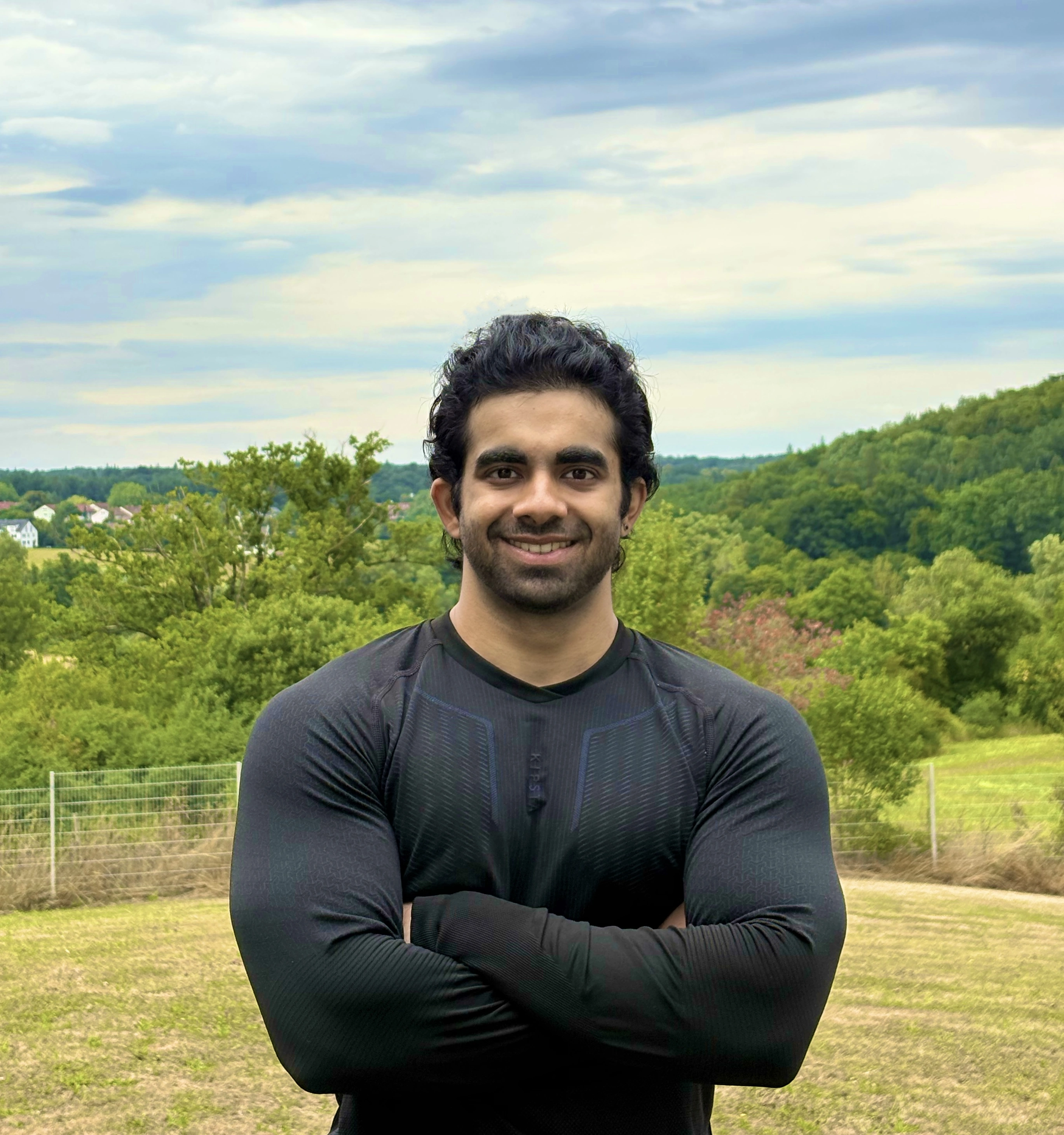Aniruddha Joshi smiling in nature